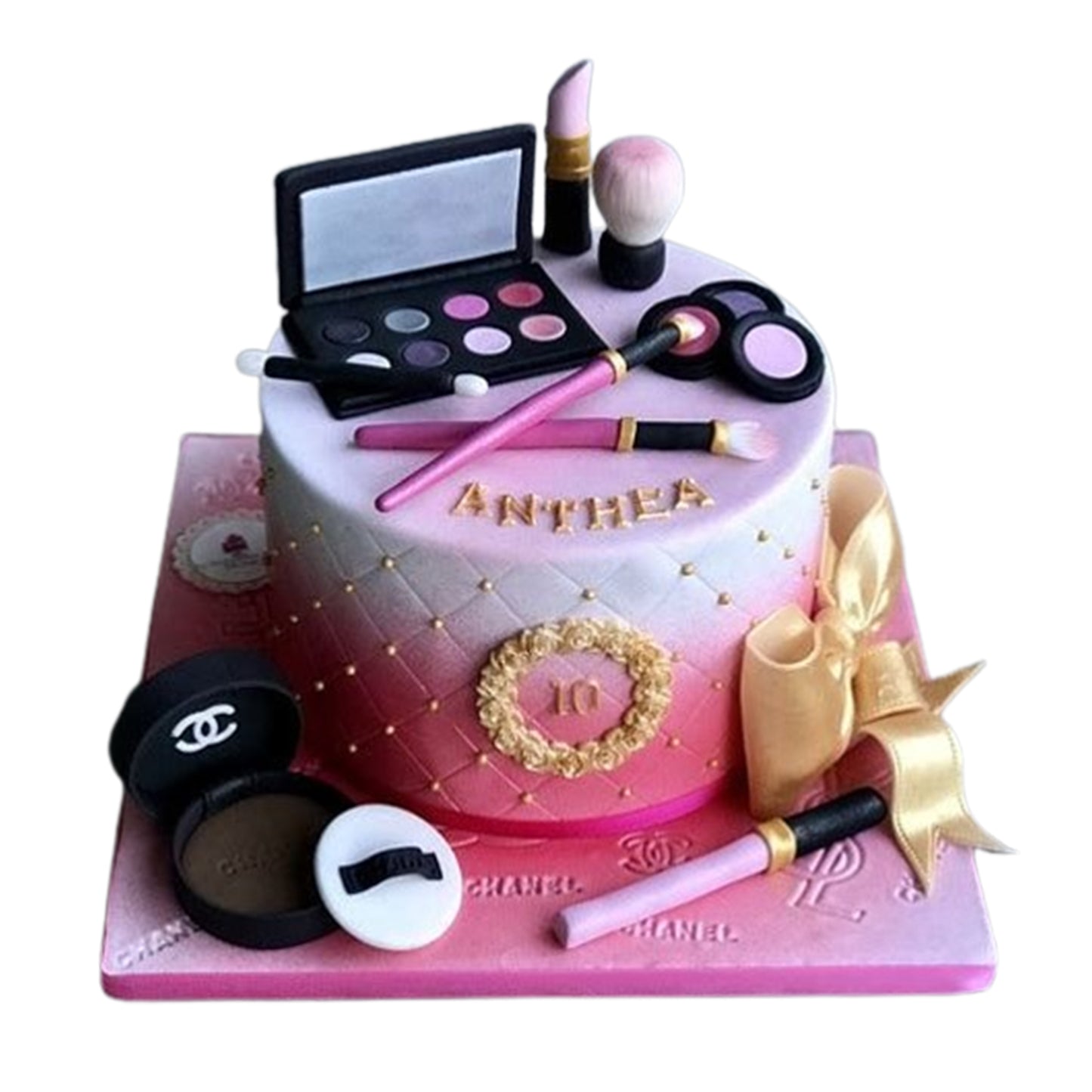Realistic edible makeup brushes and tools crafted from fondant, enhancing this glamorous beauty-themed cake.