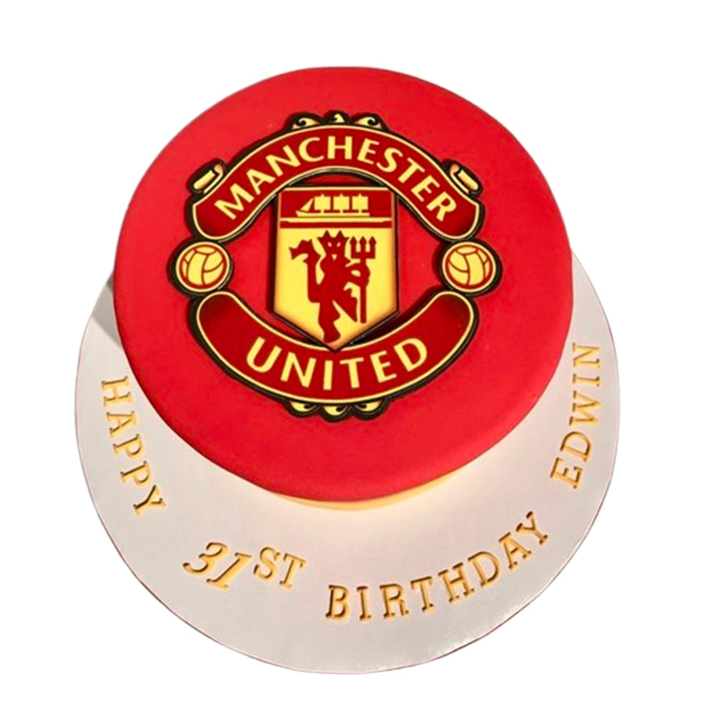 Manchester United-themed cake featuring an edible fondant crest with iconic red, yellow, and devil details.