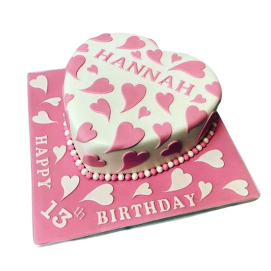 Assorted heart-shaped cakes in varying sizes, from petite single-serving desserts to elaborate multi-tiered designs for celebrations