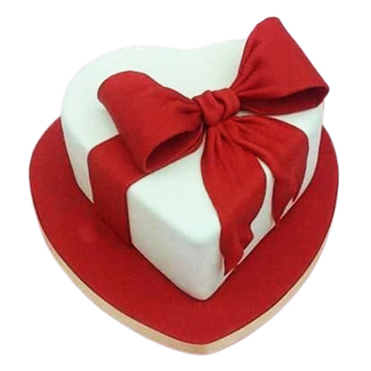 A heart-shaped cake with personalized decorations, ready for a custom message or celebration