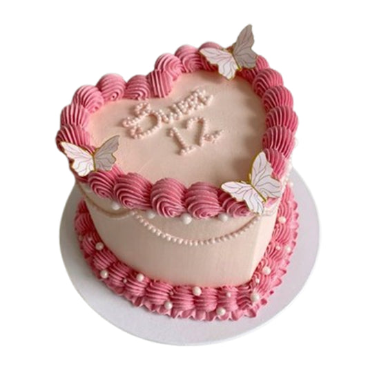 Freshly baked heart-shaped cake with multiple layers and delicious fillings like buttercream, ganache, or fruit preserves, available with free delivery
