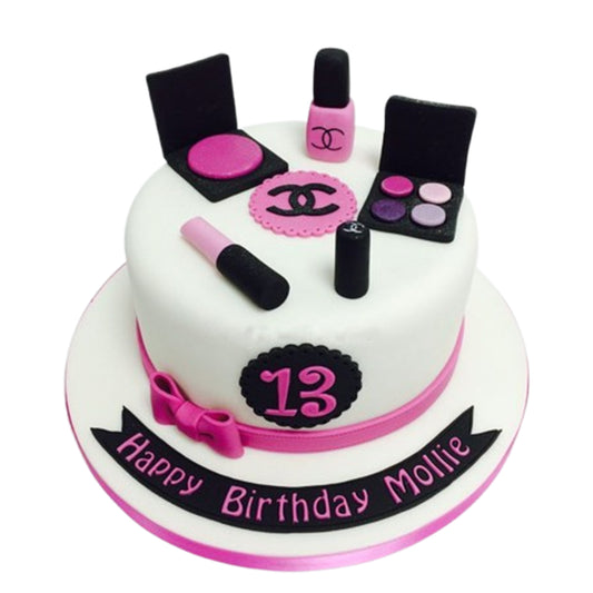 Makeup bag-shaped cake designed to open up, revealing realistic fondant-sculpted makeup items like brushes, lipsticks, and powders