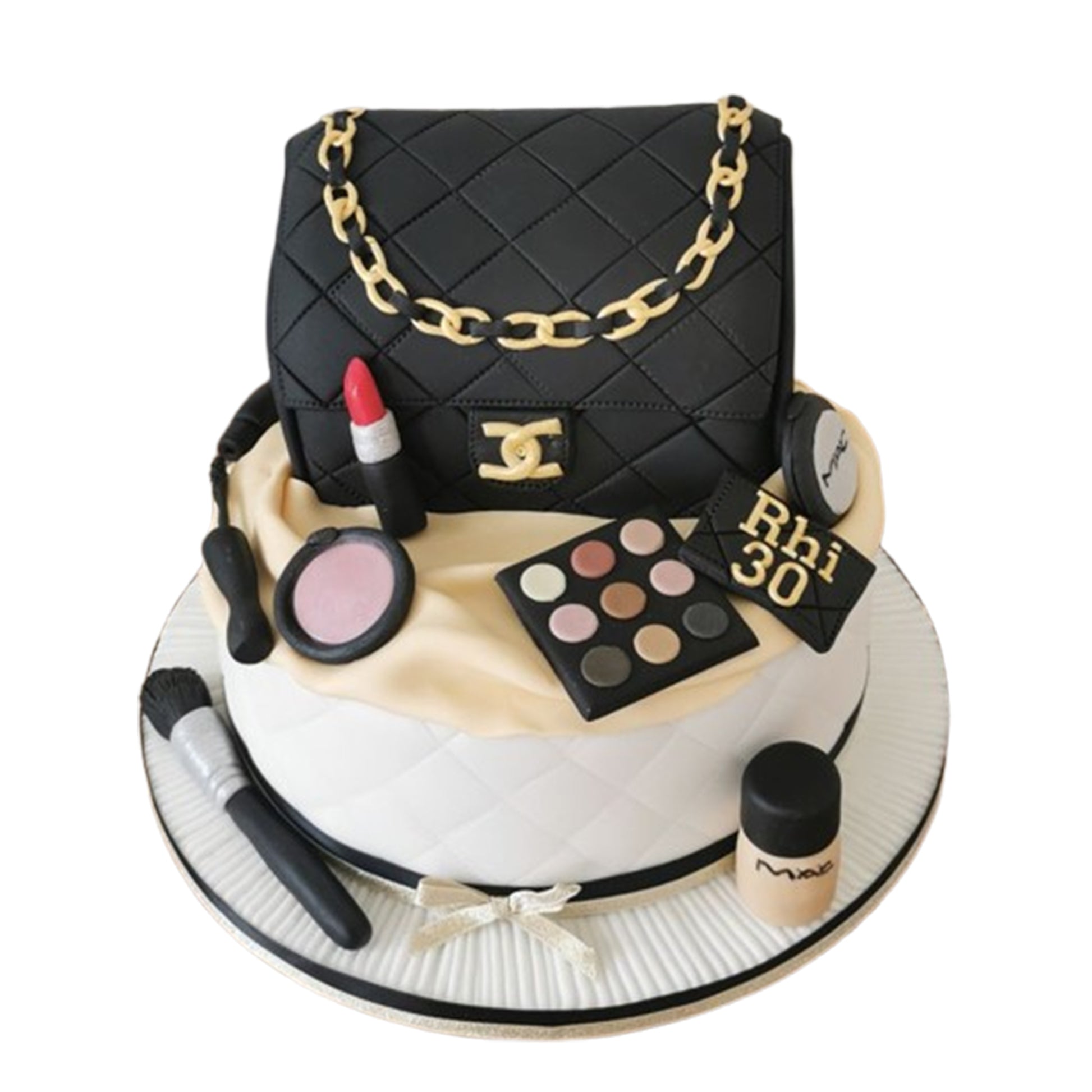 Ultra-glossy edible makeup pieces like lipsticks and compacts with mirror-like finishes on a stunning beauty-themed cake.