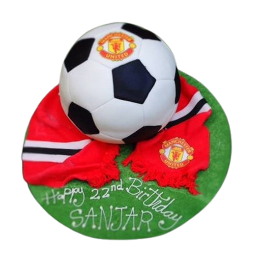 Manchester United-themed cake with soccer ball textured base tier and iconic club colors in fondant.