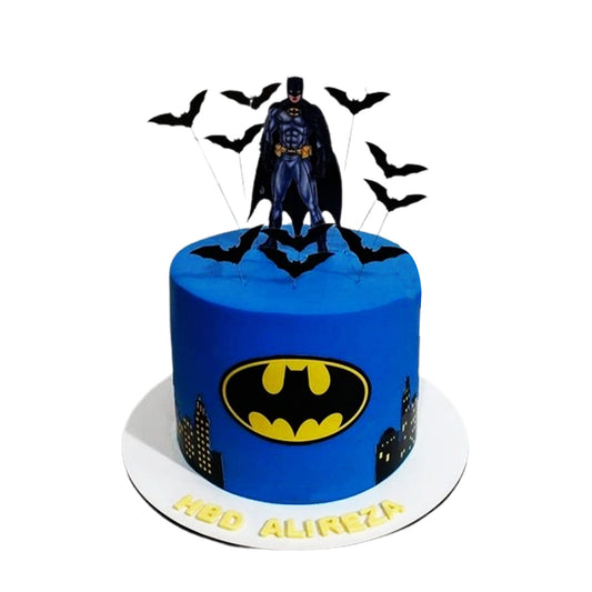 Batman Cake V1 - round birthday cake with black buttercream, yellow Batman logo and city skyline, topped with a Batman figure